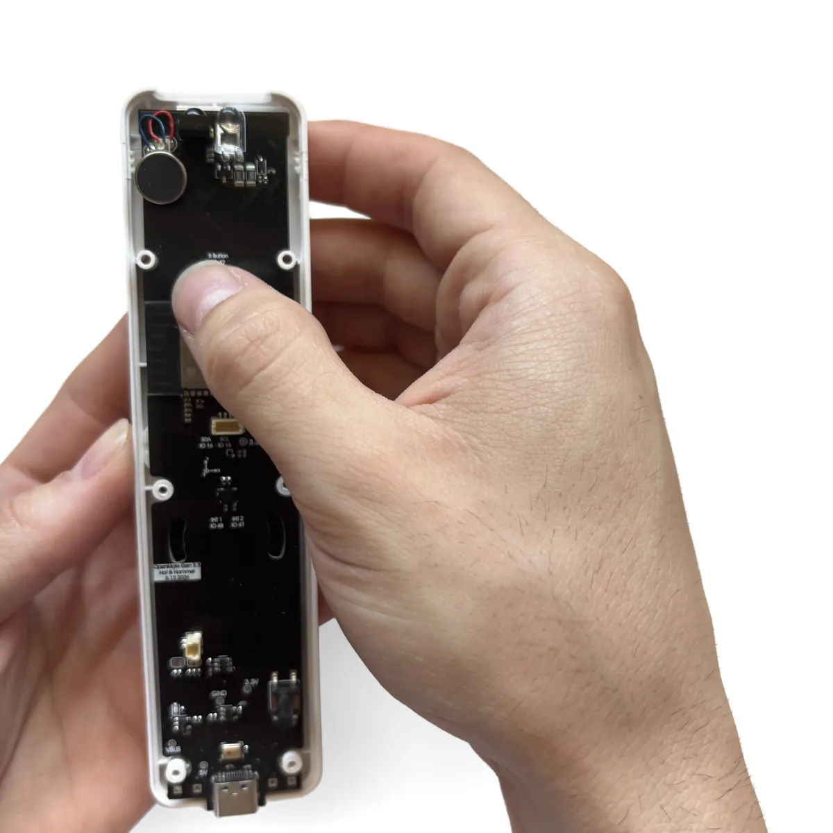 OpenMote board resting flat on the button membranes inside the top shell