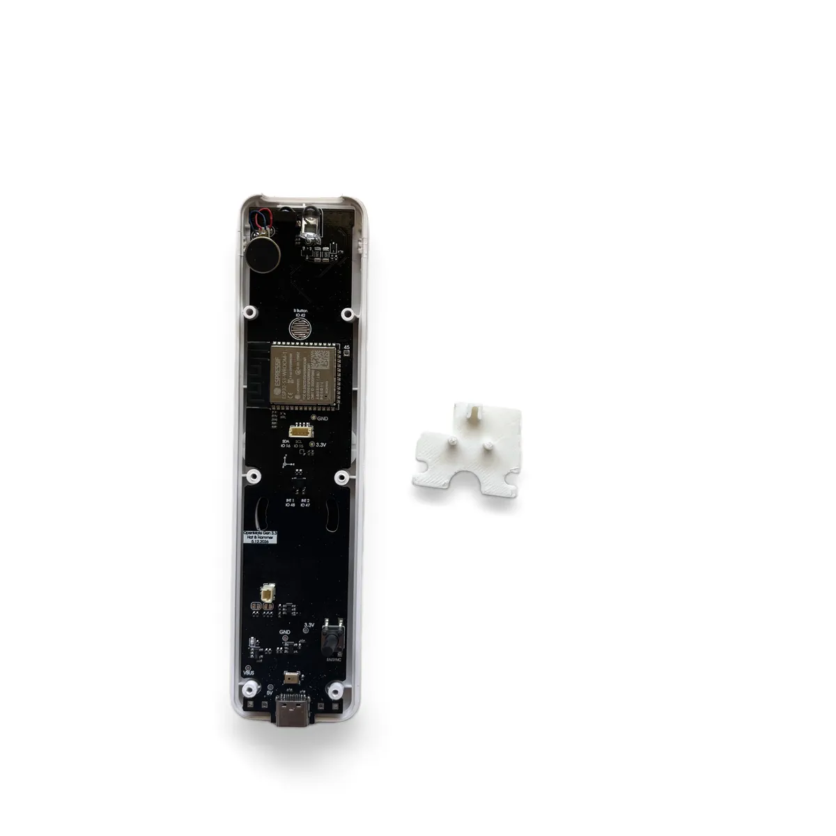 White B trigger bracket held above the top end of the board