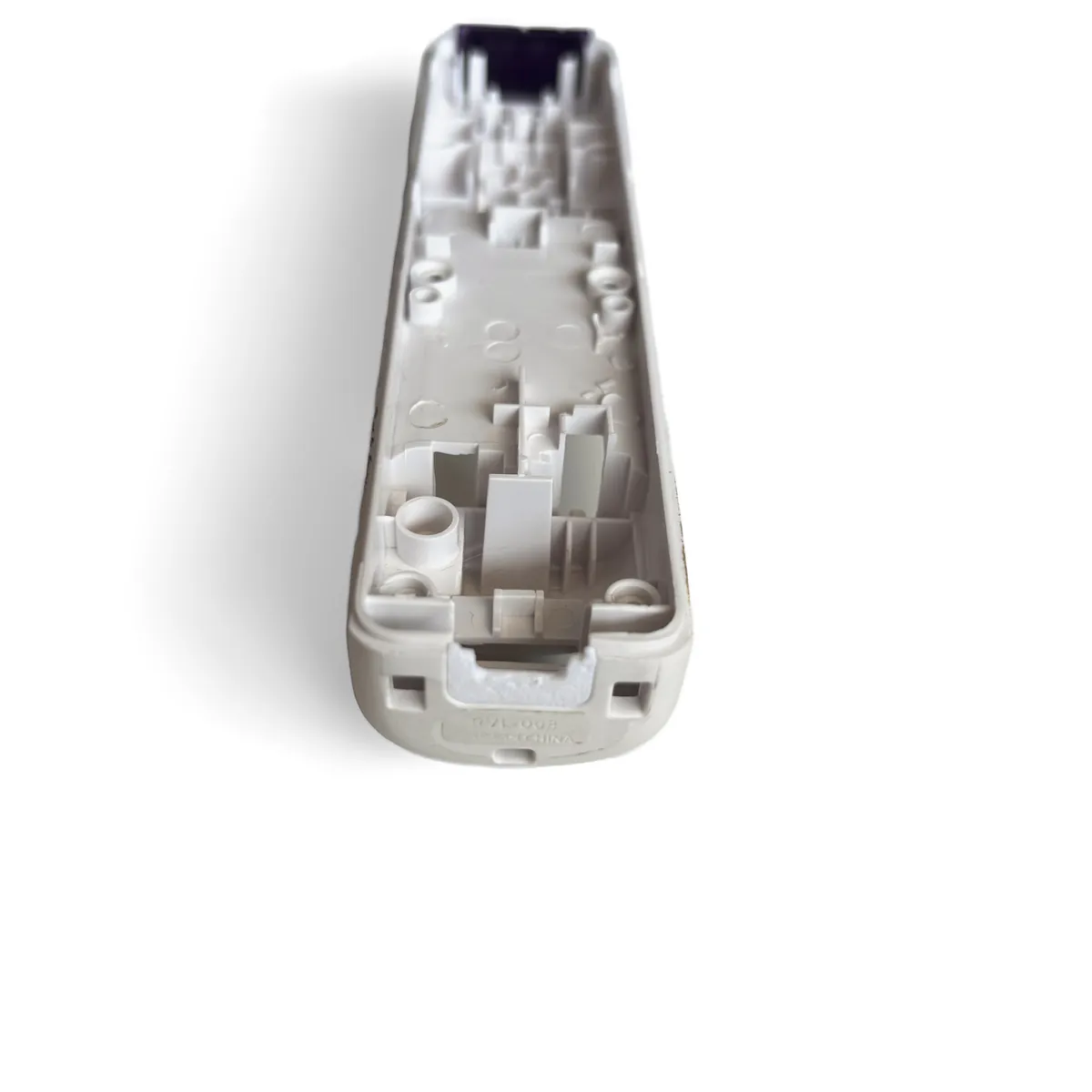 Bottom shell end with the port cover in place, the gap around the USB-C port filled